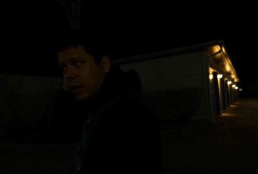 image of man in very dark lighting outside